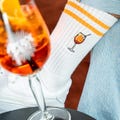 Spritz Aperitif Socks for Cocktail Fans • Embroidered Organic Cotton Sports Socks for Women & Men • Funny Tennis Socks with Aperol Motif product logo
