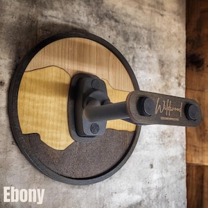Handcrafted ebony wood guitar wall mount hanger with engraved arm block and adjustable padded instrument supports