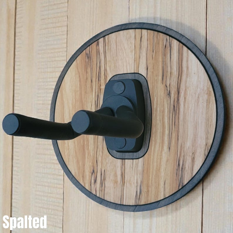 Spalted wood guitar hanger wall mount with round layered hardwood base and black foam covered steel support arms