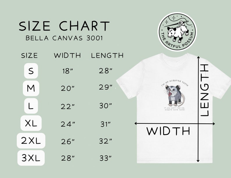 Op de afbeelding: Maattabel voor Bella Canvas 3001 T-shirts, met breedte- en lengtemaat in inches voor maten S tot en met 3XL. De tabel wordt weergegeven op een wit T-shirt met een afbeelding van een opossum en de tekst "I'm an acquired taste. If you don't like me, acquire some taste."