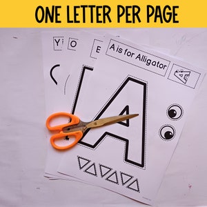 Puede incluir: Una actividad de alfabeto imprimible para ni&ntilde;os. La imagen muestra una p&aacute;gina con la letra A, una imagen de un caim&aacute;n y el texto "A is for Alligator". Tambi&eacute;n hay tijeras en la p&aacute;gina.