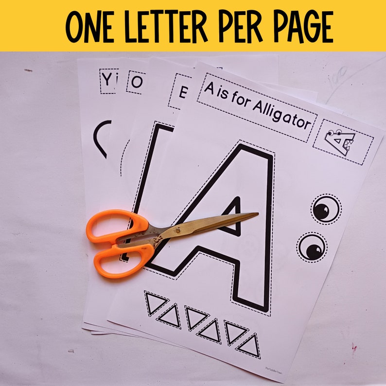 Puede incluir: Una actividad de alfabeto imprimible para ni&ntilde;os. La imagen muestra una p&aacute;gina con la letra A, una imagen de un caim&aacute;n y el texto "A is for Alligator". Tambi&eacute;n hay tijeras en la p&aacute;gina.