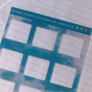 May include: A clear sticker sheet with a blue sky and white clouds background. The sheet has nine blank squares for stickers. The text "NEKO EMOTE STICKERZ BY DIGIPUNI" is at the top of the sheet.