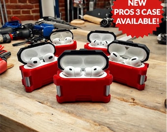 May include: Four red and black protective cases for wireless earbuds, each containing white earbuds. A red starburst graphic in the upper right corner displays the white text NEW PROS 3 CASE AVAILABLE! The cases feature a rugged design with silver accents.