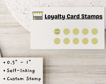 May include: A white card with the text "Loyalty Card Stamps" and a grid of 10 yellow circles. The card also has the text "YOUR LOGO" and a small illustration of a shop with a sign that says "stampbooth". The text below the card reads "0.5" - 1", "Self-Inking", and "Custom Stamp".