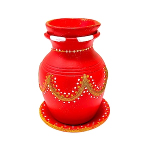 May include: A vibrant red ceramic pot with a matching saucer. The pot is adorned with gold and white decorative patterns. The design includes a gold chain around the neck and white accents. The pot is likely used for decorative purposes.