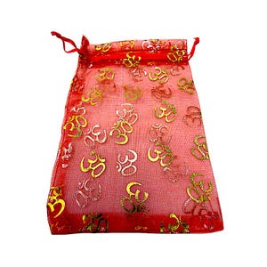 May include: Red sheer drawstring bag with gold and silver Om symbols. The bag is made of a lightweight, see-through material and is ideal for small gifts or jewelry. The drawstring is red.