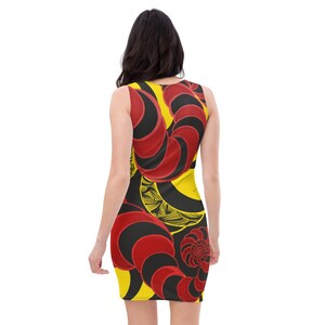 May include: A sleeveless dress with a yellow, red, and black abstract pattern. The pattern features curved lines and swirls.