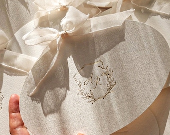 Oval-Cut Wedding Invitation with Gold Foil Printing, Embossed Monogram, and a Chiffon Ribbon, Envelope Included