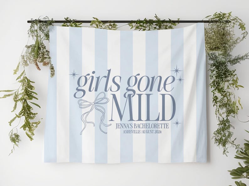 May include: A blue and white striped banner with the text "girls gone mild" in blue lettering. The banner also includes a decorative bow and the text "Jenna's Bachelorette Asheville | August 2024".
