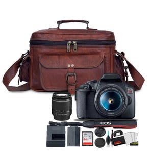 May include: A brown leather camera bag with a black DSLR camera, lens, and accessories. The camera has a zoom lens and the word "EOS" printed on the body. Accessories include a charger, memory card, and cleaning kit.