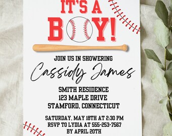 May include: A white baby shower invitation with a baseball theme, featuring red and black details. The words "IT'S A BOY!" are above a baseball and bat illustration. The invitation includes event details and RSVP information.