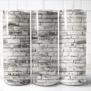 May include: Three stainless steel tumblers with a white brick pattern. The tumblers are all the same size and have a clear lid.