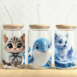 May include: Three glass jars with lids and straws, each containing a different animal illustration. The first jar has a white and gray cat with blue eyes and a blue bow tie. The second jar has a blue whale with white spots. The third jar has a white wolf with blue eyes.