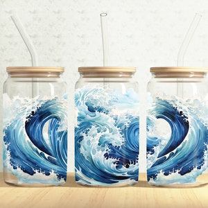 May include: Three glass jars with bamboo lids and clear drinking straws. Each jar features a blue and white watercolour design of a wave crashing.