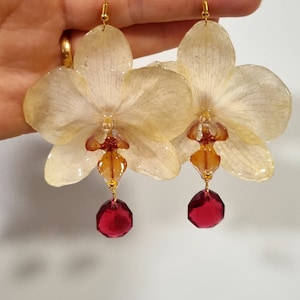 Real orchid earrings , Natural orchid flowers earrings . Resin flowers .