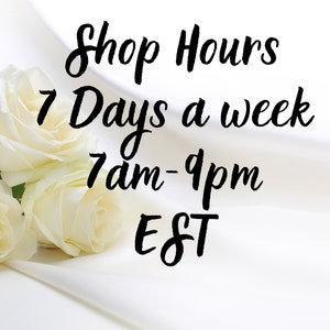 May include: Shop hours are 7 days a week from 7 am to 9 pm EST. The image features three white roses on a white fabric background.