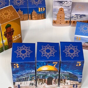 May include: A set of colorful, illustrated dice with numbers 3, 4, 5, 6, 7, 19, 22, 23, 25. The dice feature images of mosques and other Islamic architecture.