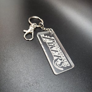 Llavero/dije para bolso y cartera de Los Angeles LAKERS