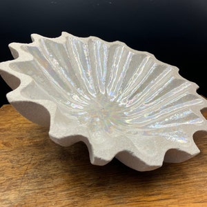 Handmade Sea Shell Inspired Decorative Bowl Carved from Stoneware Clay with an Iridescent Mother of Pearl Lustre Glaze on the inside.
