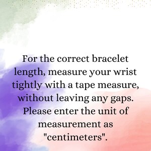 May include: Text on a pink, purple, and blue watercolor background with gold glitter. The text reads: "For the correct bracelet length, measure your wrist tightly with a tape measure, without leaving any gaps. Please enter the unit of measurement as "centimeters"."