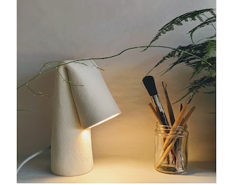 Handmade ceramic light with fabric braided cable | Contemporary Design | Folded | White textured clay | Sculptural |Desk lamp