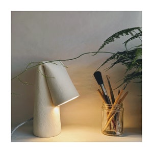 Handmade ceramic light with fabric braided cable | Contemporary Design | Folded | White textured clay | Sculptural |Desk lamp