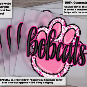 May include: A stack of heat transfer vinyl sheets featuring a pink paw print design with the word "bobcats" in black script. The design includes a pink and white splatter effect. Text on the sheets reads "Extra-wide cut margins" and "100% Customizable!"