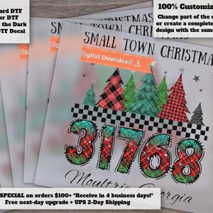 May include: A digital design featuring the text SMALL TOWN CHRISTMAS and the number 31768 in a red and green plaid pattern. The graphic includes stylized Christmas trees, a black and white checkered border, and the text Moultrie Georgia.