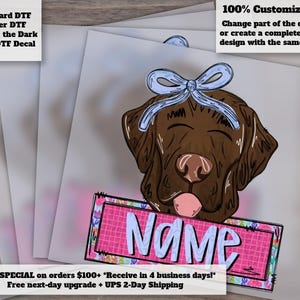 May include: A DTF decal featuring a brown dog with a light blue bow on its head and a pink tongue sticking out. Below the dog is a rectangular pink frame with a grid pattern containing the word Name in light blue, outlined in dark blue.