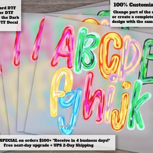 May include: A set of DTF decals featuring the letters A through K in a colorful, glossy, bubble-style font. The letters are rendered in vibrant shades of pink, green, yellow, orange, and blue, with a high-shine finish on a light gray background.