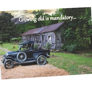 May include: Greeting card featuring a vintage black pickup truck parked in front of an old wooden house. The card has the text "Growing old is mandatory..." against a backdrop of a cloudy sky and green foliage.