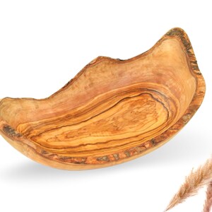 Handmade fruit bowl made of solid olive wood available in 3 sizes. The perfect one-of-a-kind!