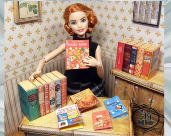 May include: A collection of miniature cookbooks for a dollhouse. The books have colourful covers with titles like "Betty Crocker's Cook Book" and "Cooksy Book".