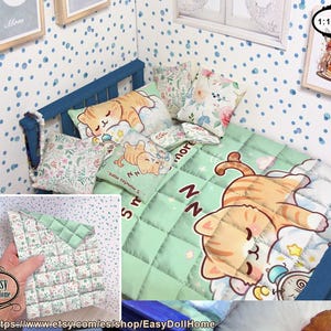 May include: A miniature doll's bed set with a blue frame, a green quilt with a cartoon cat, and floral and cat-printed pillows. The set includes a small framed picture and is designed in 1:12 scale. The quilt has the text "NN" and "5 minutes more."