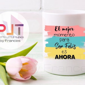 May include: White ceramic mug with a colorful design and the text "El mejor momento para Ser Feliz es AHORA".