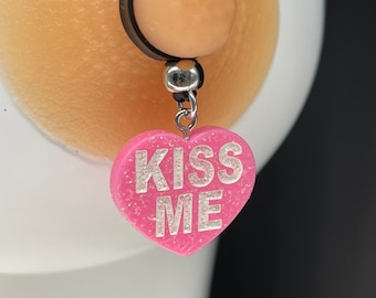 Pink sparkly heart with , kiss me.
