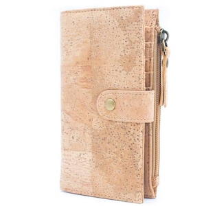 May include: A light brown cork wallet with a zippered pocket and a snap closure. The wallet has a textured cork surface and a gold-colored button.