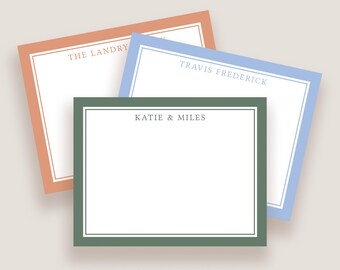 May include: Three rectangular stationery cards with colored borders. The top left card has a peach border and reads THE LANDRY. The top right card has a light blue border and reads TRAVIS FREDERICK. The front card has a sage green border and reads KATIE & MILES.