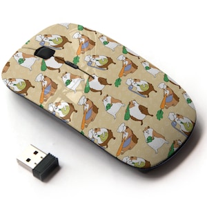 May include: A wireless computer mouse with a beige background and a repeating pattern of cartoon guinea pigs wearing chef hats and holding carrots and vegetables.