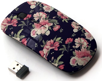 May include: A wireless computer mouse with a floral design. The mouse is dark blue with pink and white flowers. It has a USB receiver.
