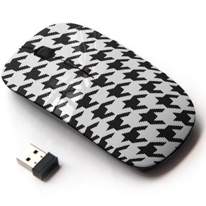 May include: A black and white wireless mouse with a houndstooth pattern. The mouse comes with a small USB receiver.