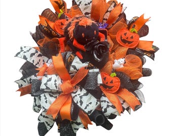 Ghirlanda di ragni di Halloween fatta a mano