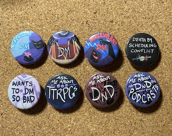 May include: A collection of eight round buttons with various designs and text. The buttons feature phrases like "Benevolent DM," "Death by Scheduling Conflict," and "Ask Me About D&D Podcasts." The color palette includes blues, purples, and black.