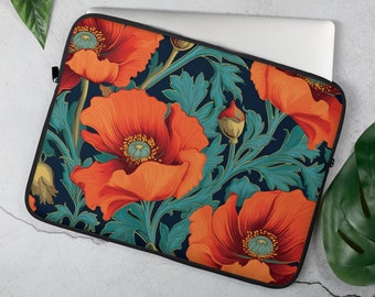 May include: A laptop sleeve featuring a floral design with large orange poppies and teal leaves against a dark blue background. The sleeve has a black zipper and is partially covering a silver laptop.