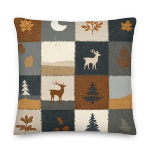 May include: Square decorative pillow with a patchwork design featuring forest and nature-themed illustrations. The design includes images of deer, trees, leaves, and a crescent moon in shades of brown, gray, and cream.
