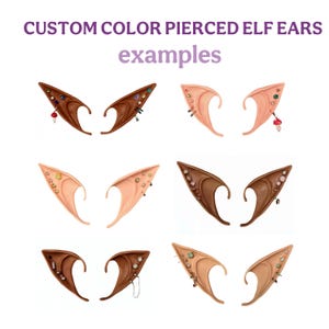 May include: Examples of custom color pierced elf ears. The image shows several pairs of elf ear prosthetics in various skin tones and colors, adorned with different types of piercings and jewelry. The text "CUSTOM COLOR PIERCED ELF EARS examples" is at the top.