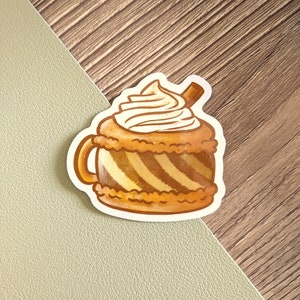 May include: A cartoon illustration of a brown and white striped mug with whipped cream and a cinnamon stick on top. The mug is filled with a brown liquid.