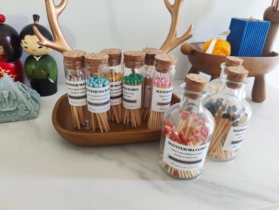 Color-tipped scented matches in an apothecary glass vial with a built-in striker — 316 favorites confirms this tiny, gorgeous object punches way above its $5 price point.