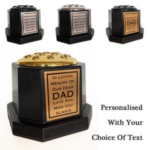 May include: Black hexagonal flower vase with a gold top and a brass plaque that reads "In loving memory of our dear Dad Love and miss you always". The vase is personalised with your choice of text.